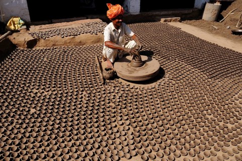 Potter making sand lamps on a potter wheel, Jodhpur, Rajasthan, India Mr#786