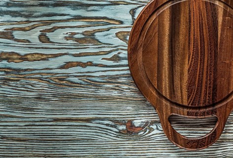 Carving board on vintage wooden surface