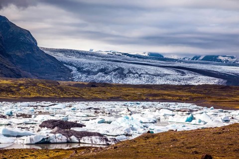Sunrise in the Ice Lagoon. Drift ice Ice Lagoon - Jokulsarlon. Ice floes are reflected in the