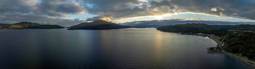 Evening mood at Loch Alsh with Tulach Ard hill and Skye Bridge, drone shot, Reraig, Kyle, Scotland,