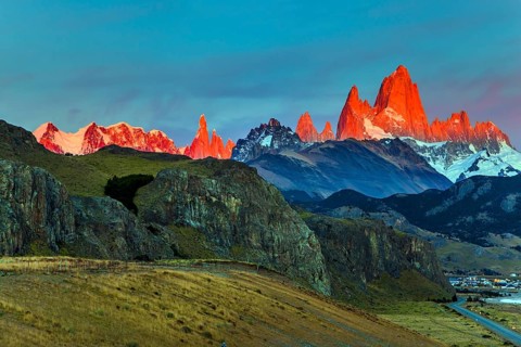 The grand crimson dawn over the mountain range Fitzroy. Mountain peak in Patagonia in the border
