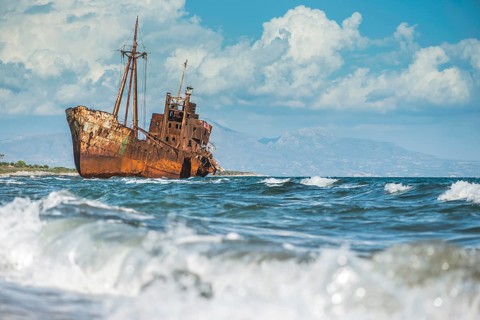 Old rustic big ship. Blue sky