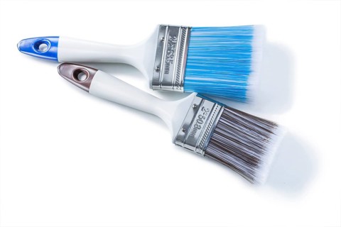 Two white paint brushes with plastic bristle isolated
