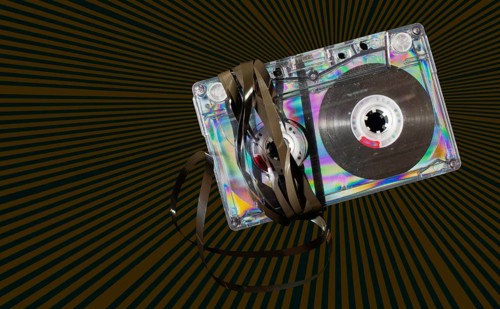 Vintage cassette tape on vintage rays background