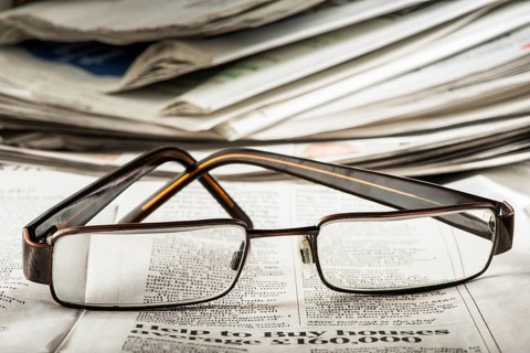 Glasses on newspaper. Natural lightings