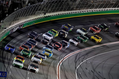 NASCAR Cup Driver, AJ Allmendinger (16) races off turn four during the Quaker State 400 Available