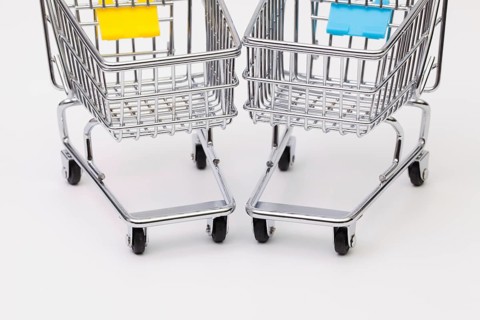 Two shopping trolley on the white background