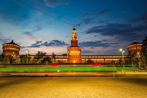 Sforzesco Castle and tram in the evening, Milan, Italy