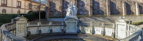 Panoramic photo of the source of the Danube and the Mother Baar figure group in front of the