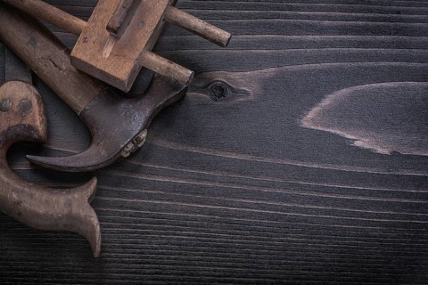 Top view of messy hand saw surface gauge claw hammer