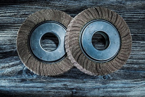 Used polishing flap discs on vintage wooden board