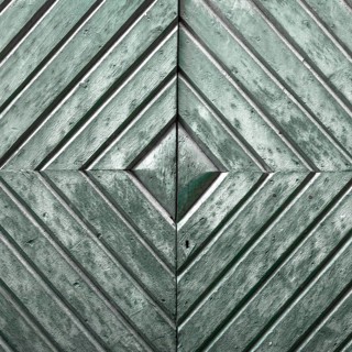 Details of an old wooden door with diamond pattern