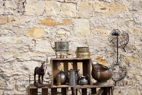 Still life in front of a natural stone wall