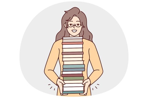 Smiling young woman in glasses with pile of books enjoy reading. Happy girl with stack of textbooks