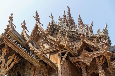 Close-up of an ornately carved wooden temple with lots of detail, Pattaya, Thailand