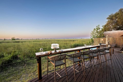 Terrace with bar on the main channel, Okuti Camp, Moremi Game Reserve, Okavango Delta, Maun,