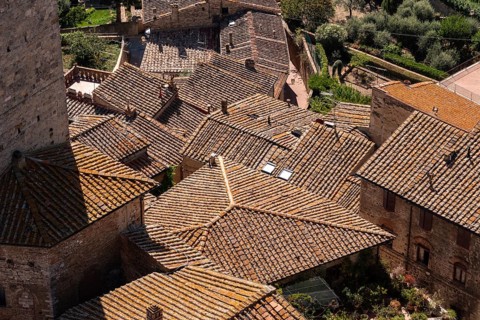 Wide panoramic view over downtown San Gimignano, seen from Torre Grosso, Italy