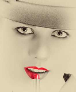 Portrait of a stylish woman with a hat and bright red lips