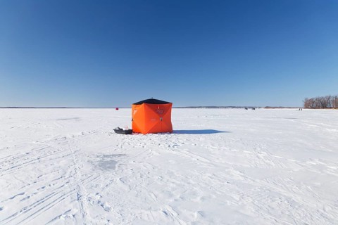 Winter, icefishing tent on the frozen Saint Lawrence River, Province of Quebec, Canada