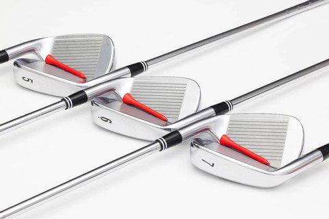Titanium golf clubs on the white background