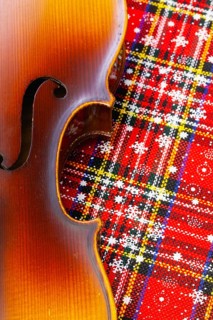 Photo of old violin on Christmas decoration. Winter holidays. Merry christmas and happy new year