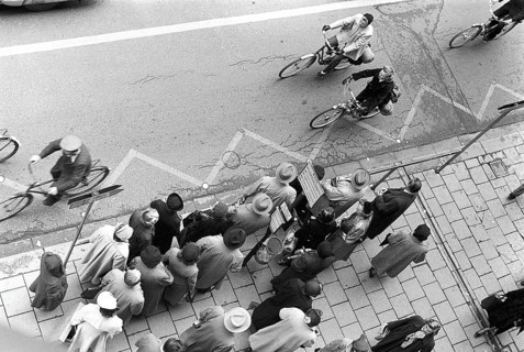 Bus stop in Stockholm in 1953. People are waiting for the bus at the bus stop. Stockholm Sweden