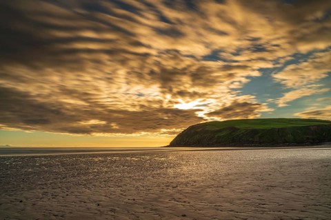 Sunset and dark clouds over the St Bees Heritage Coast near Whitehaven in Cumbria, England, UK