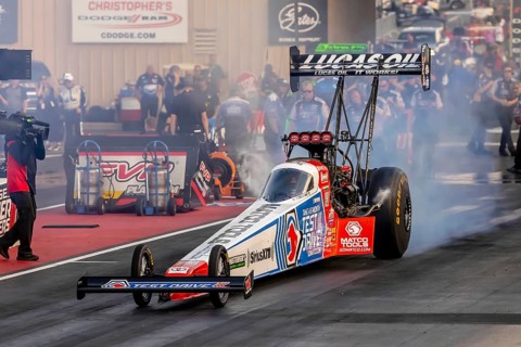 NHRA driver, Antron Brown, prepares to qualify for the Dodge Power Brokers NHRA Mile-High Nationals