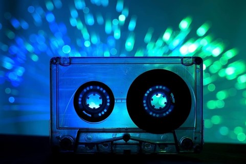 Transparent Cassette tape and blue color disco light background