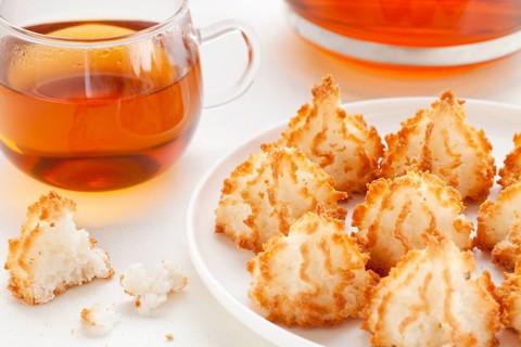 Plate of coconut macaroon cookies and cup of tea