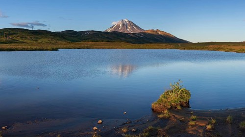 Stunning evening panoramic mountainous landscape of Kamchatka Peninsula at sunset: scenery autumn