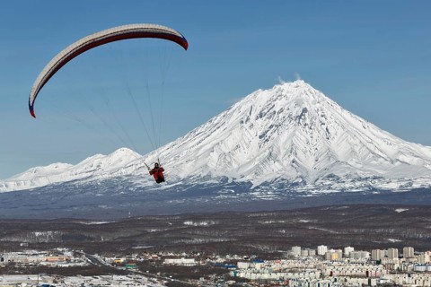PETROPAVLOVSK-KAMCHATSKY, KAMCHATKA, RUSSIA, NOVEMBER 21, 2014: Paraglider flying over