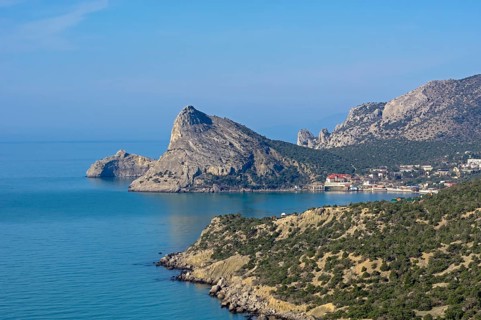 Seascape. View of the resort village Novy Svet from the top of the coastal mountain. Crimea. Sunny