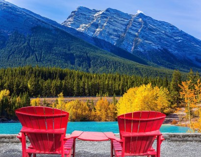 Artificial Abraham lake reflects the golden foliage of aspen and birches. Rocky Mountains of