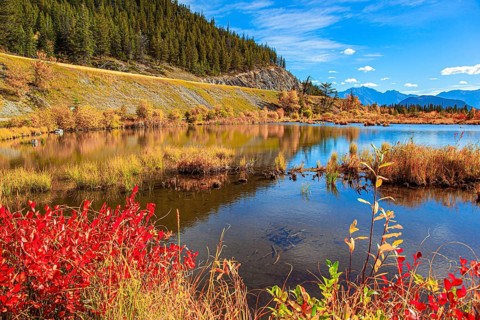 Beautiful fall day in the Rocky Mountains of Canada. Magnificent golden autumn. Mountains and lakes