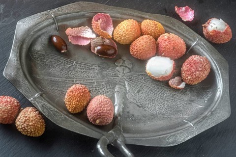 Lychees on an Art Nouveau plate (pewter)