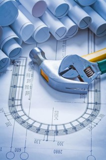 Claw hammer adjustable key and collection of blueprint rolls construction concept