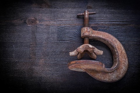 Old clamp on vintage wood board