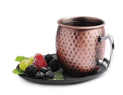 food still-life, Metal camp mug with tea with berries