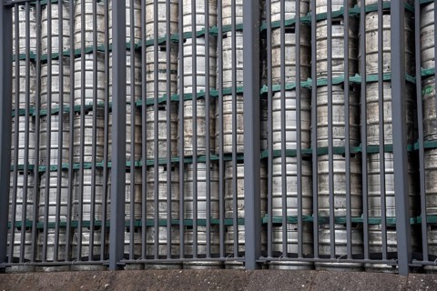 Stack of beer barrels in a brewery factory