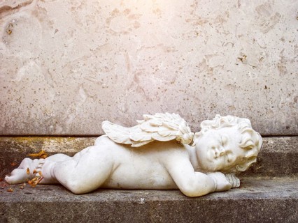 An image of a sleeping angel grave statue