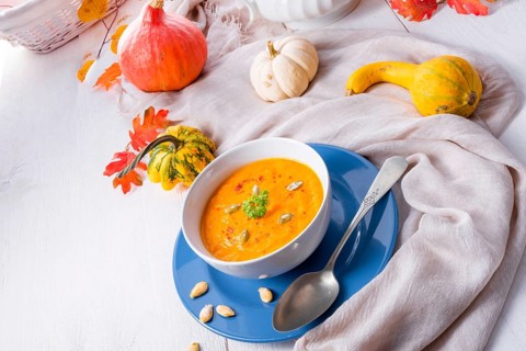 Healthy pumpkin soup with ginger carrots and coconut milk