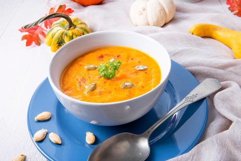 Healthy pumpkin soup with ginger carrots and coconut milk