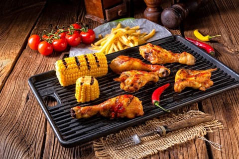 Rustic Grilled chicken wings, legs, and spicy corn