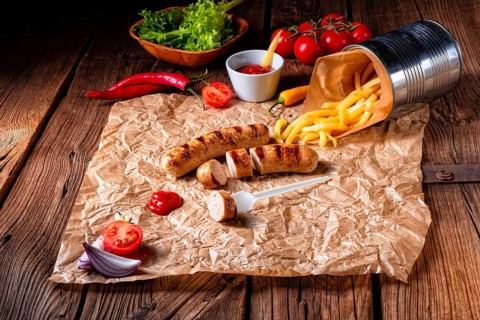 Rustic bratwurst with pommes and hot ketchup