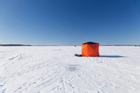 Winter, icefishing tent on the frozen Saint Lawrence River, Province of Quebec, Canada