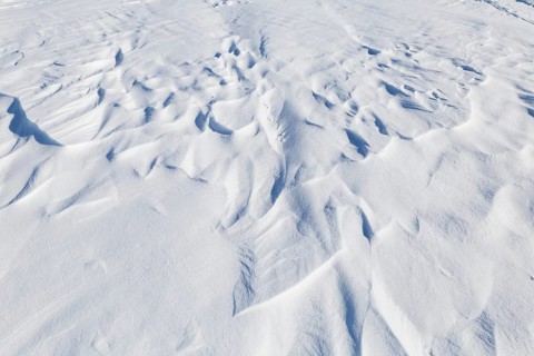 Winter, snowdrift pattern on a frozen river, Province of Quebec, Canada