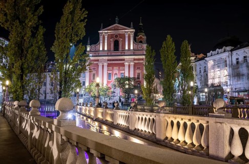 Famous Three Bridges and the Preseren square in the center of Ljubljana illuminated at night,