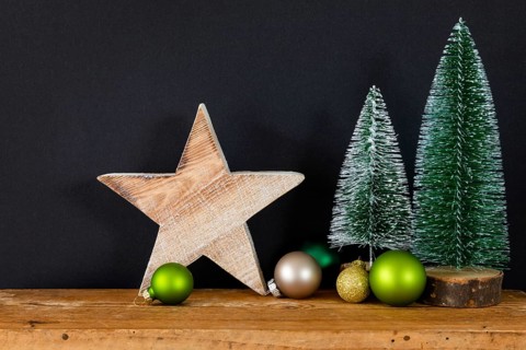 A Christmas decoration black background with tree glass balls and star