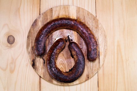 Fried Sausages On a Wooden Board